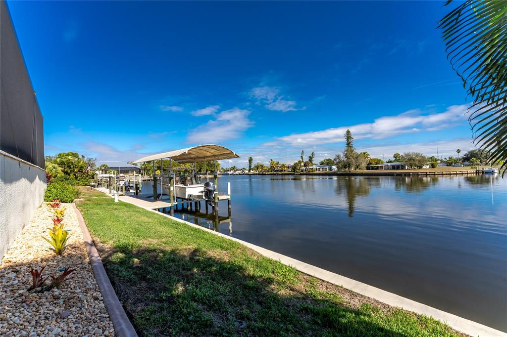 265 Severin Road Southeast Port Charlotte, FL 33952 - Photo 75 of 88 a view of a lake with houses