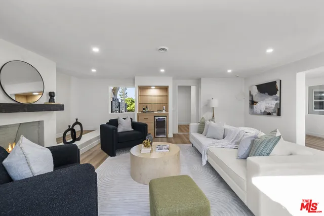 a bathroom with a sink mirror and toilet