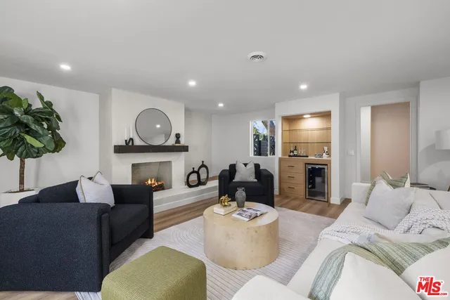a view of a work space with furniture and a potted plant