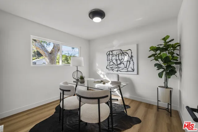 a bedroom with a bed and a mirror