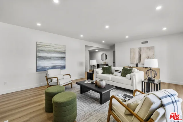 a living room with furniture and a table