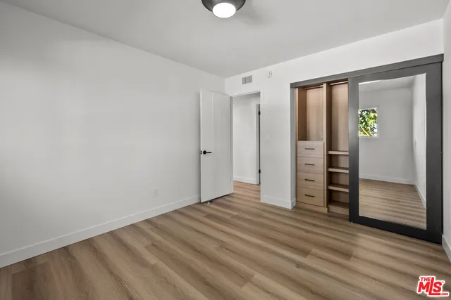 a view of balcony with two chairs and a fire pit
