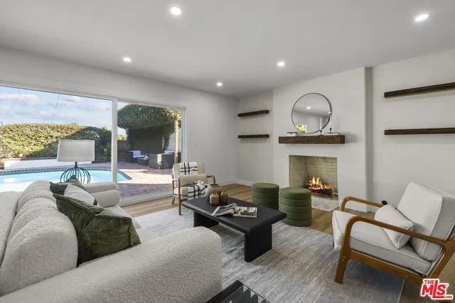 a kitchen with a dining table chairs sink and cabinets