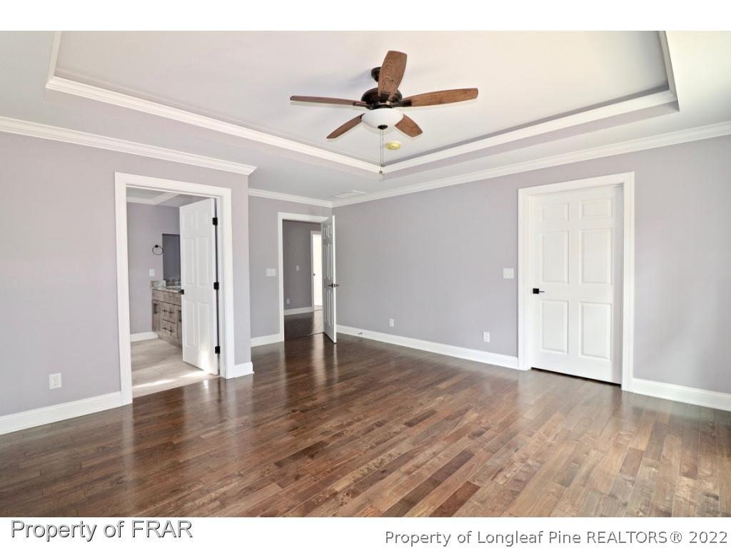 873 Morrison Bridge Road Vass, NC 28394 - Photo 15 of 35 a view of an empty room and wooden floor