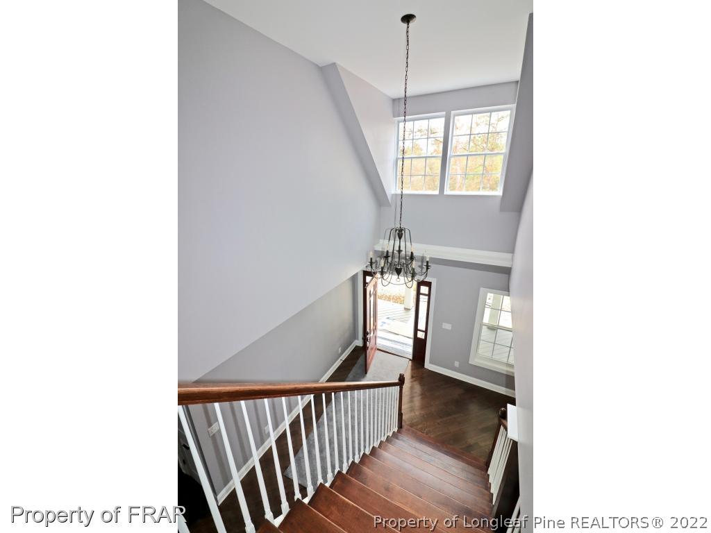873 Morrison Bridge Road Vass, NC 28394 - Photo 29 of 35 a view of a hallway with furniture and chandelier