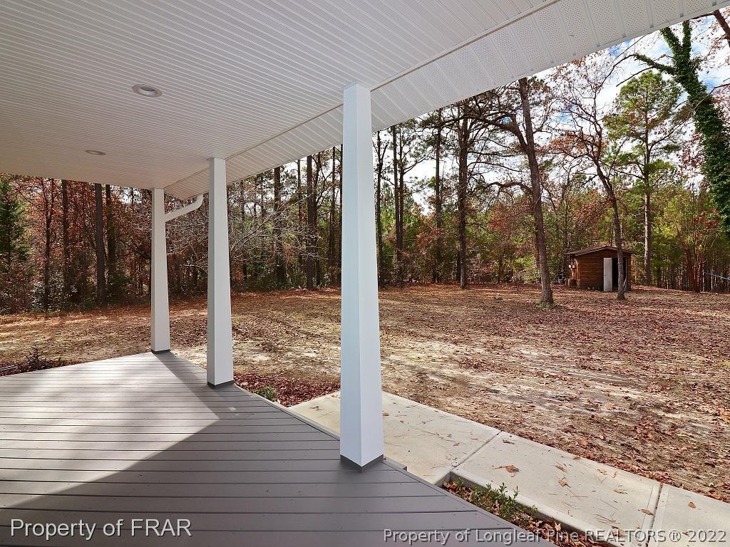 873 Morrison Bridge Road Vass, NC 28394 - Photo 3 of 35 a view of a room with wooden floor and wooden fence