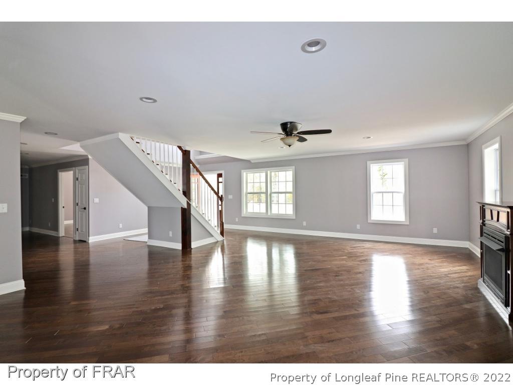 873 Morrison Bridge Road Vass, NC 28394 - Photo 7 of 35 a view of an empty room with wooden floor and a window