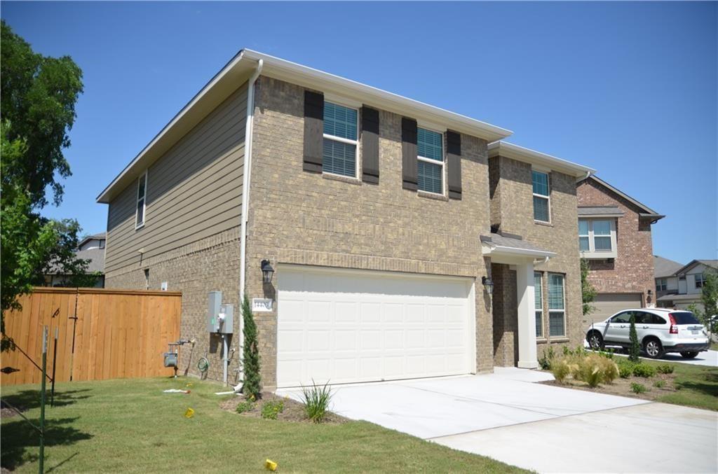 14403 McCoy Loop Austin, TX 78717 - Photo 2 of 29 Two-story brick and siding residence, complete with an attached garage and a neatly maintained yard.