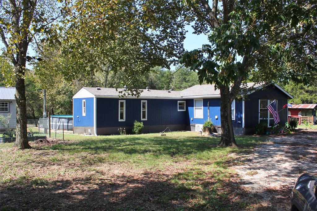 12608 Valverde Loop Terrell, TX 75161 - Photo 2 of 30 a house that has a tree in front of it