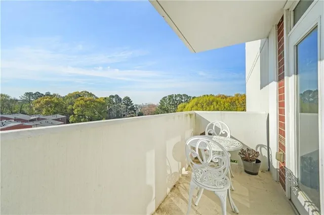 a view of balcony with furniture