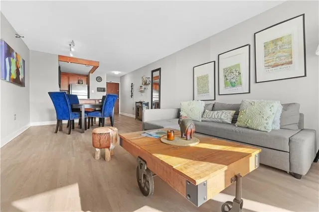 a living room with furniture a dining table and a piano