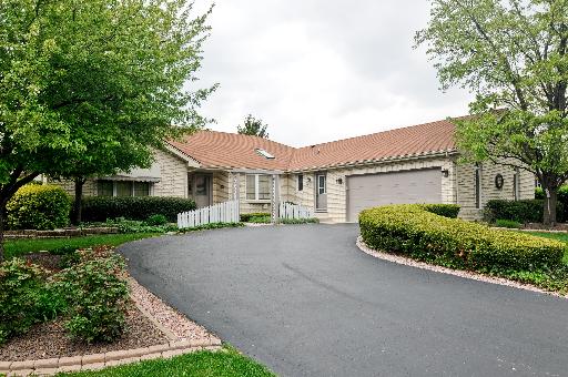 21218 Deerpath Road Frankfort, IL 60423 - Photo 1 of 12 a front view of a house with a yard and garage