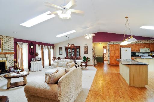 21218 Deerpath Road Frankfort, IL 60423 - Photo 4 of 12 a living room with furniture a window and a chandelier