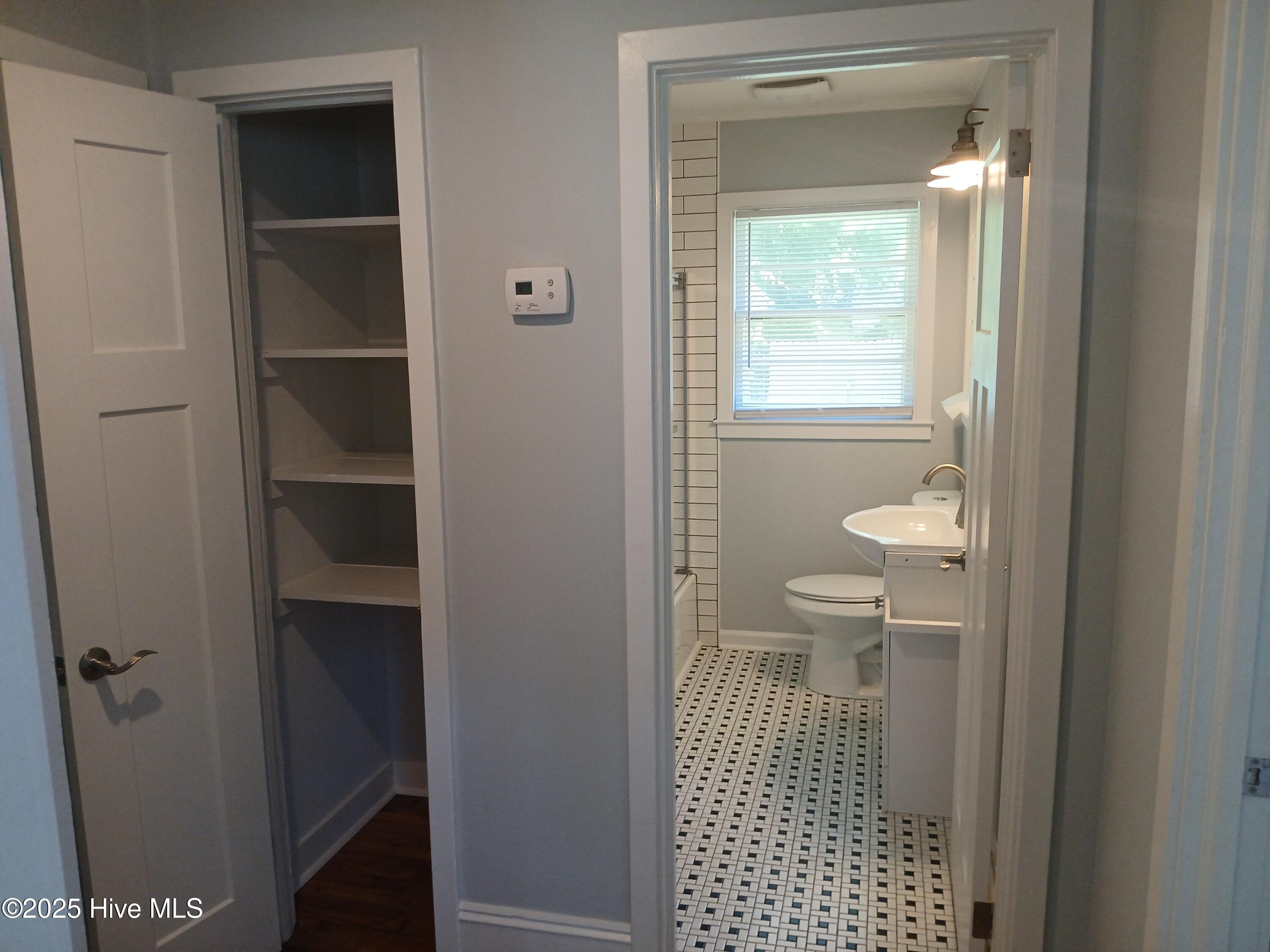 5501 Myrtle Grove Road, Unit B Wilmington, NC 28409 - Photo 6 of 9 5501 B Myrtle Bathroom & Hall Linen Clo
