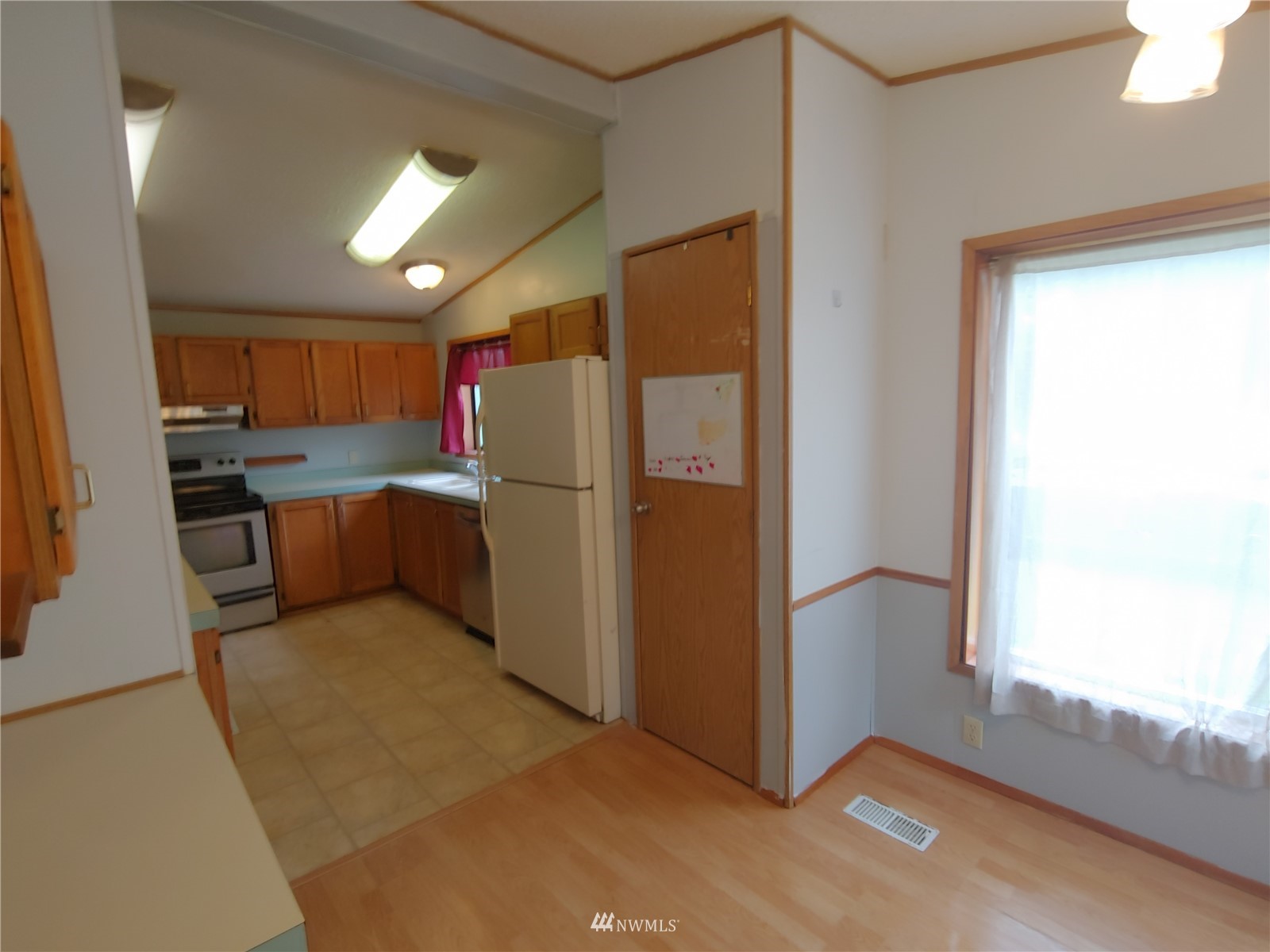383 Bunker Creek Road Chehalis, WA 98532 - Photo 11 of 35 a kitchen with stainless steel appliances granite countertop a refrigerator and a stove top oven