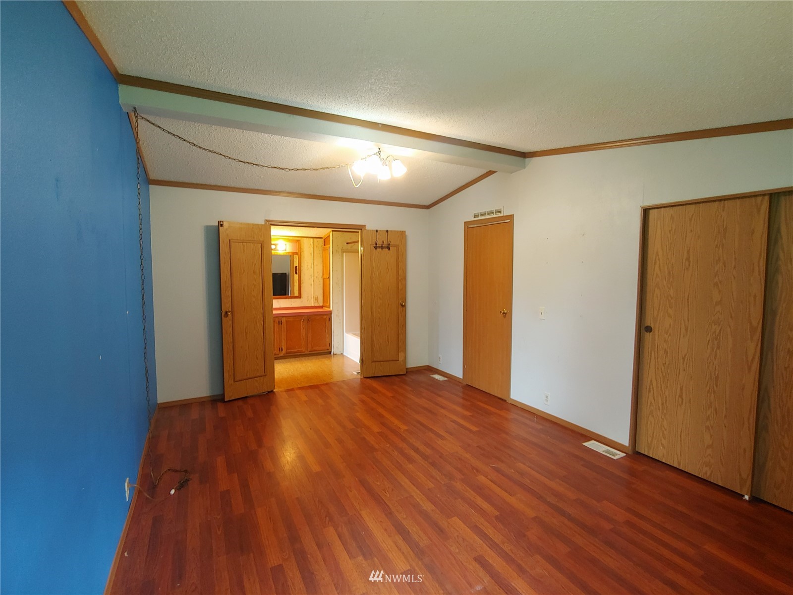 383 Bunker Creek Road Chehalis, WA 98532 - Photo 22 of 35 a view of an empty room with wooden floor and a window