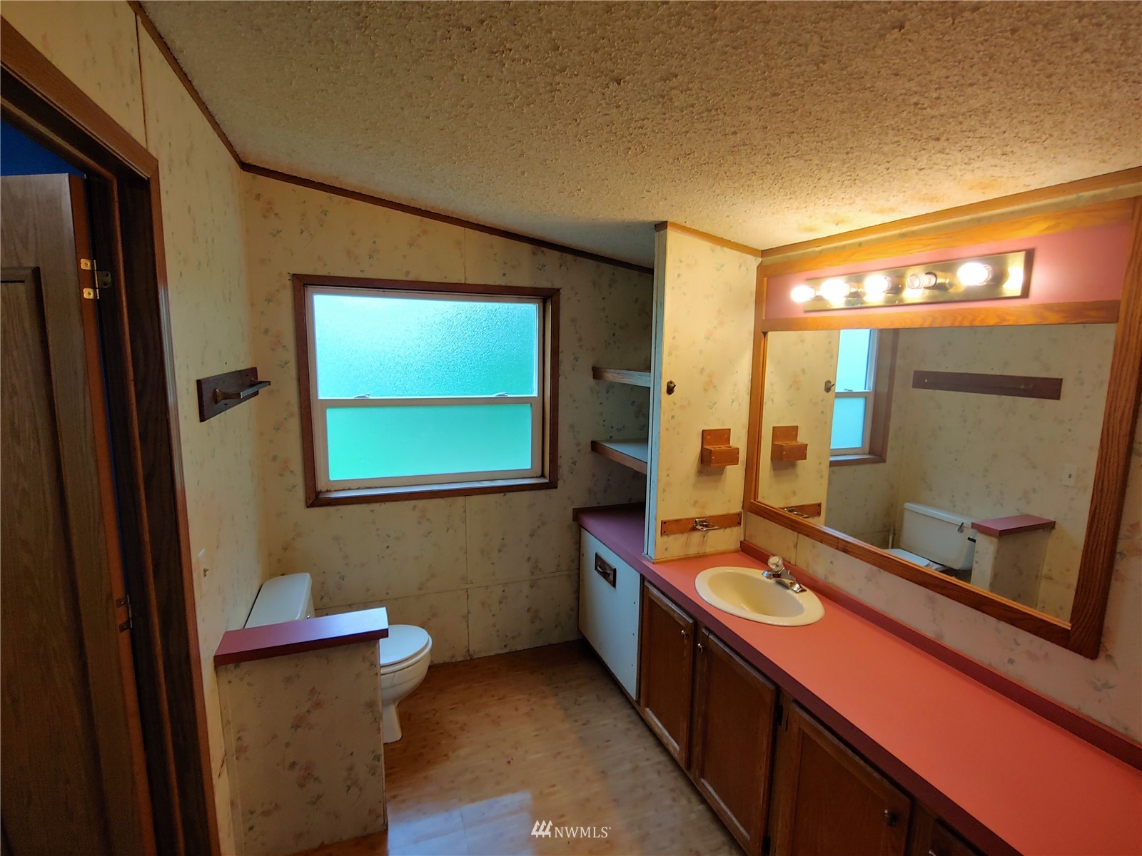 383 Bunker Creek Road Chehalis, WA 98532 - Photo 24 of 35 a bathroom with a sink and a mirror