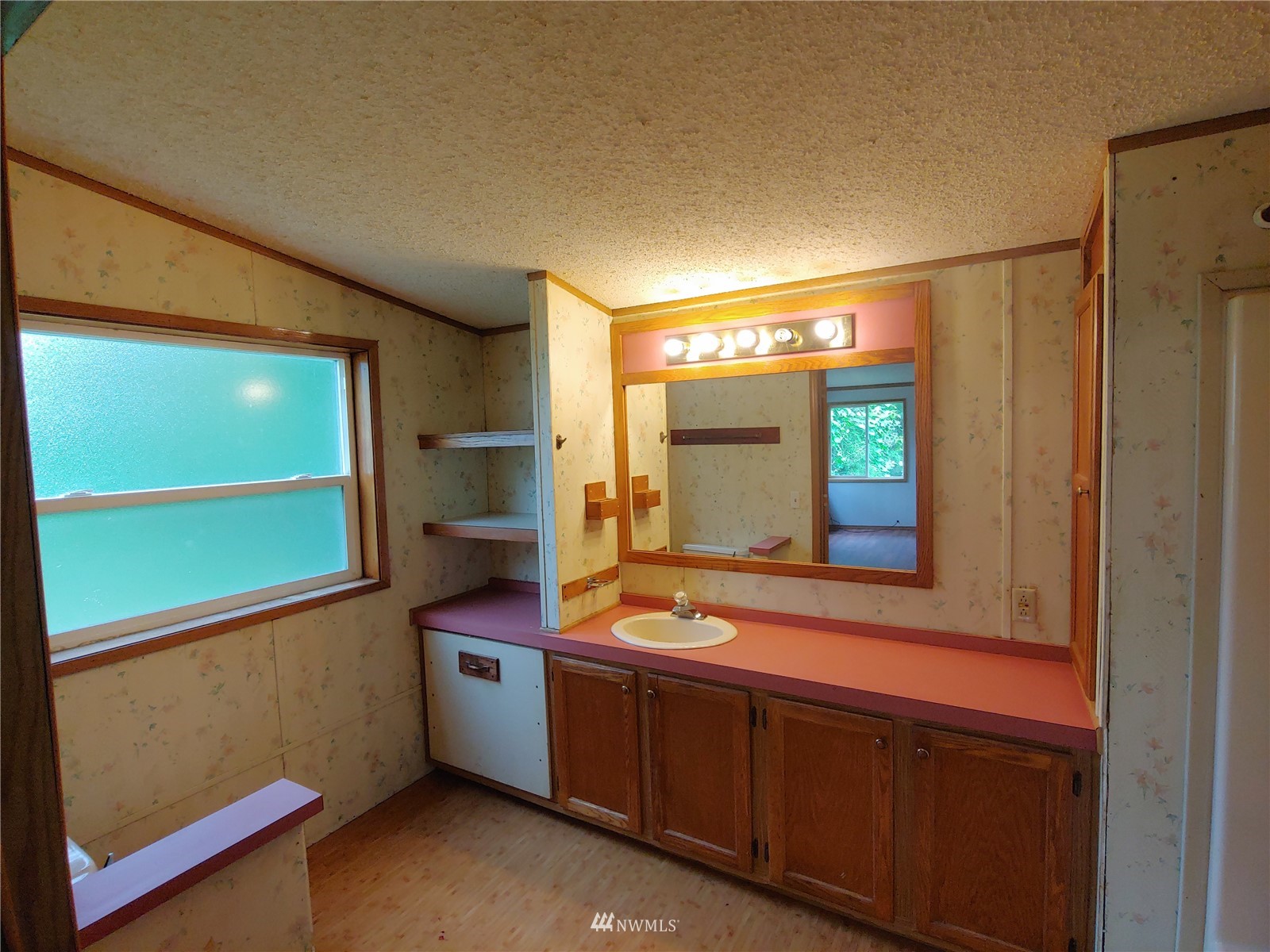 383 Bunker Creek Road Chehalis, WA 98532 - Photo 26 of 35 a bathroom with a sink and a mirror