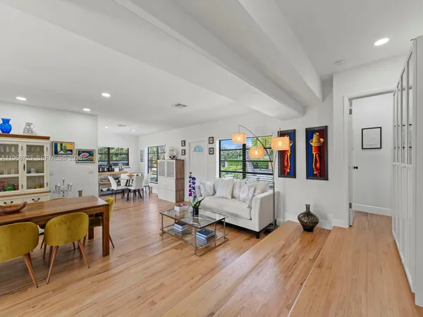 a dining room with furniture and window