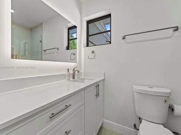 a view of a livingroom with furniture and wooden floor