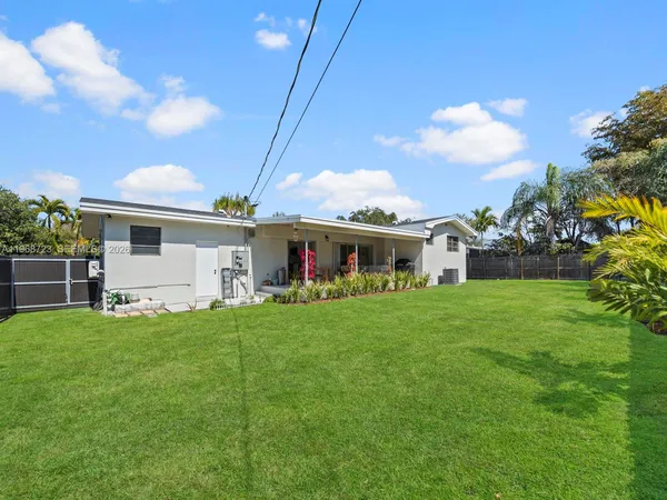a view of a backyard of the house