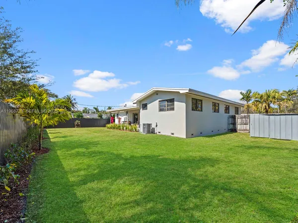 a view of a backyard of the house