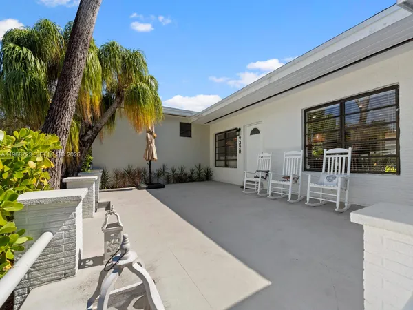 a view of house with outdoor seating and city view