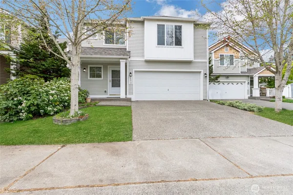 front view of a house with a yard
