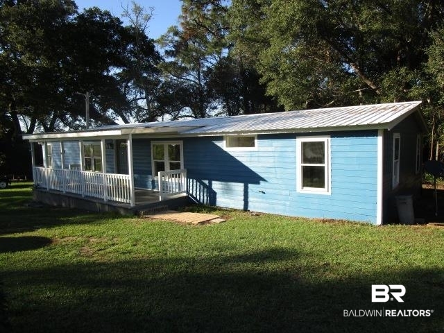 14791 Raber Road Summerdale, AL 36580 - Photo 2 of 21 Rear view of property featuring a lawn