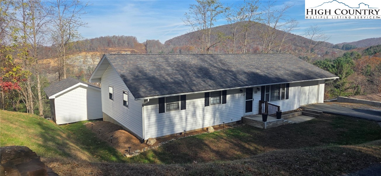 516 White Laurel Lane Boone, NC 28607 - Photo 1 of 27 a view of a house with a yard
