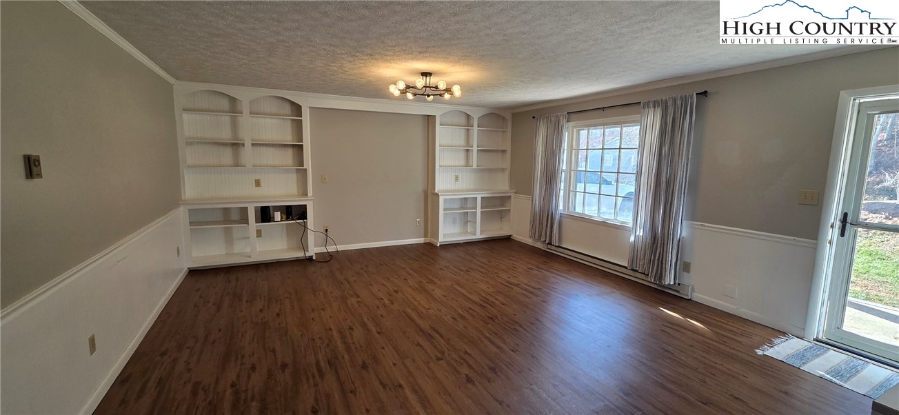 516 White Laurel Lane Boone, NC 28607 - Photo 15 of 27 wooden floor in an empty room with a window