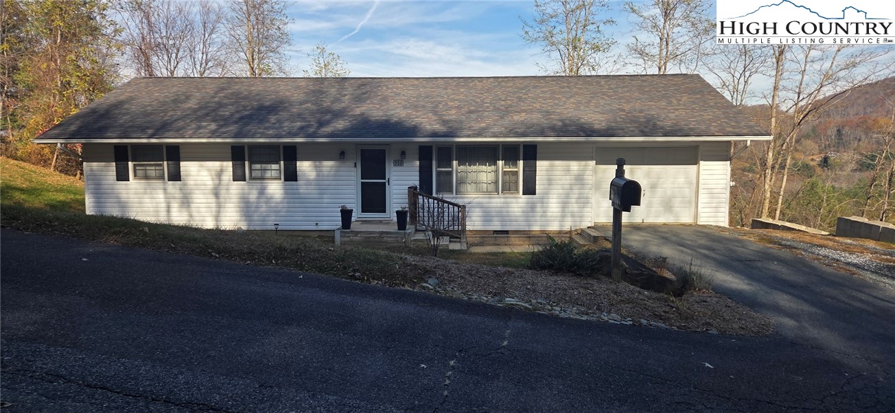 516 White Laurel Lane Boone, NC 28607 - Photo 3 of 27 a front view of a house with a yard