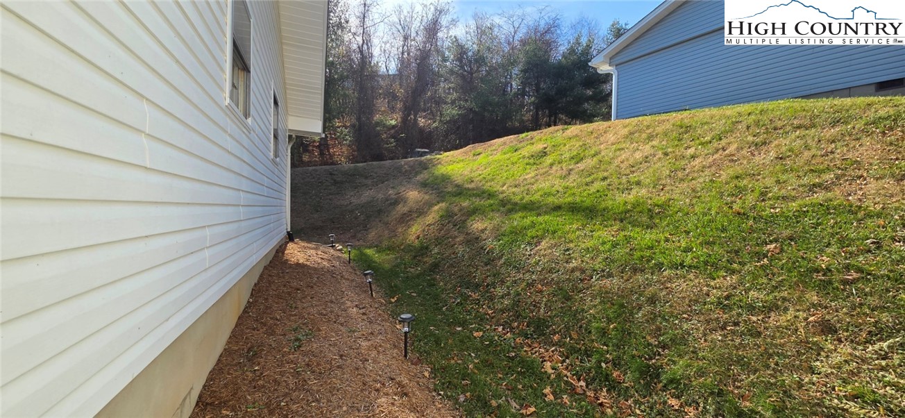 516 White Laurel Lane Boone, NC 28607 - Photo 8 of 27 a view of a backyard with pathway