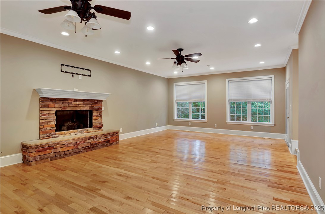389 Brookgreen Drive Lumberton, NC 28358 - Photo 5 of 44 a view of an empty room with a fireplace and a window