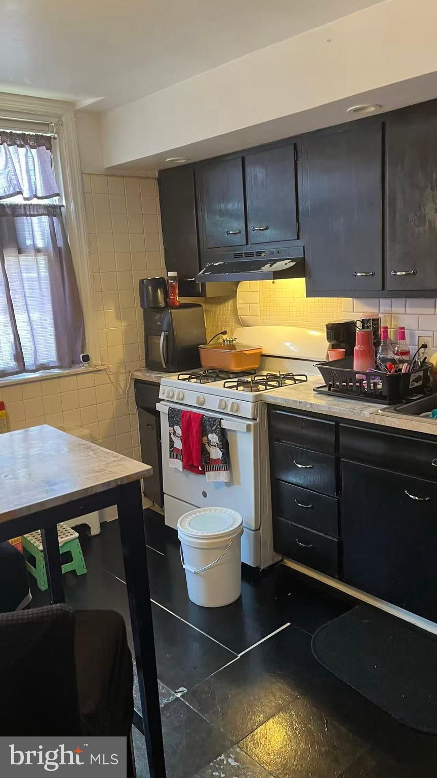 3116 Cottman Avenue Philadelphia, PA 19149 - Photo 4 of 10 a kitchen with a sink and cabinets