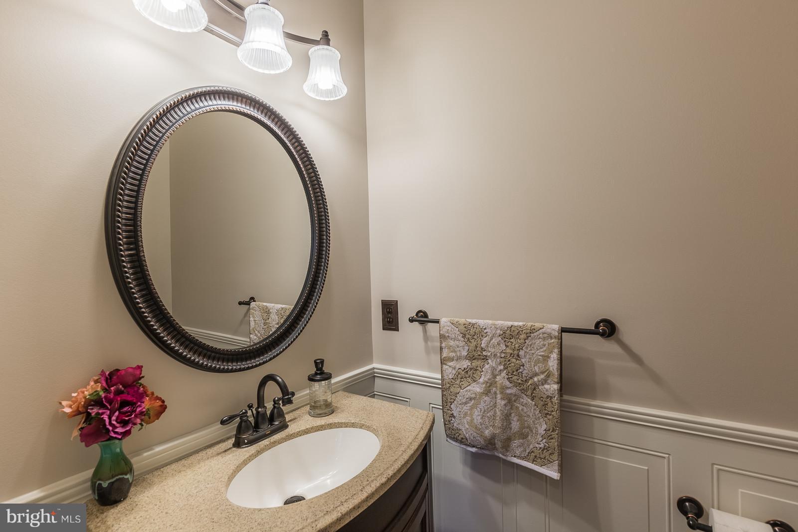 43553 Dempsey Lane Chantilly, VA 20152 - Photo 12 of 30 a bathroom with a sink and a mirror