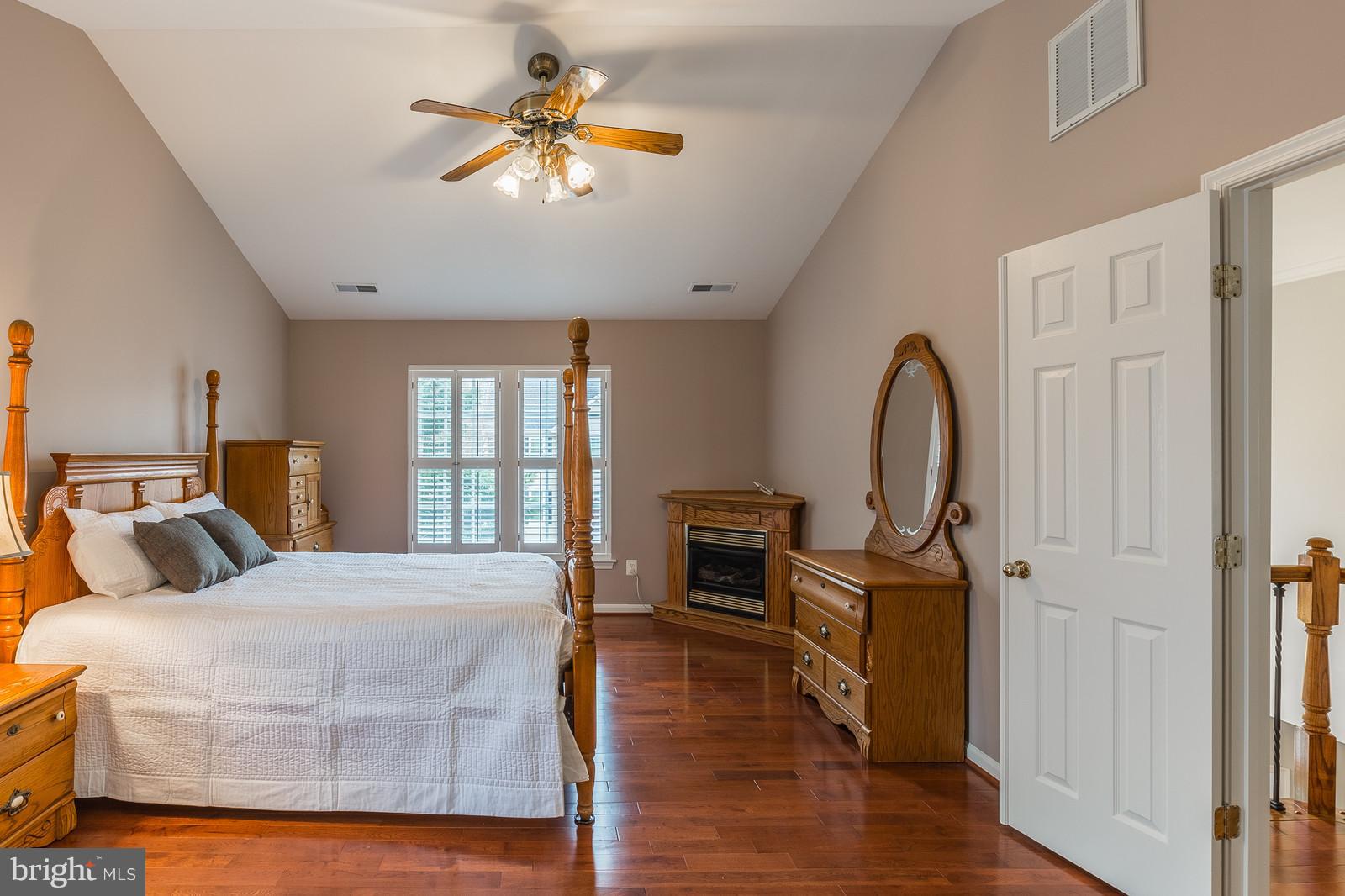 43553 Dempsey Lane Chantilly, VA 20152 - Photo 15 of 30 a bedroom with a bed a window and a chandelier