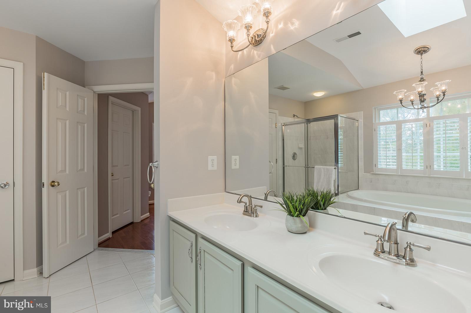 43553 Dempsey Lane Chantilly, VA 20152 - Photo 17 of 30 a bathroom with a double vanity sink and a mirror