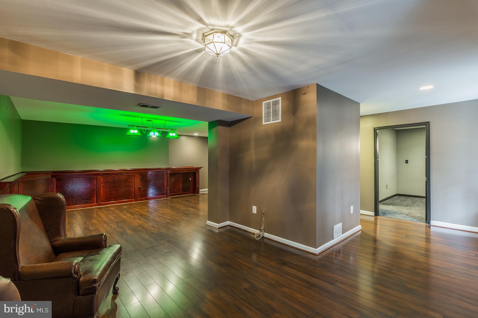 43553 Dempsey Lane Chantilly, VA 20152 - Photo 24 of 30 a view of an empty room with a window and wooden floor