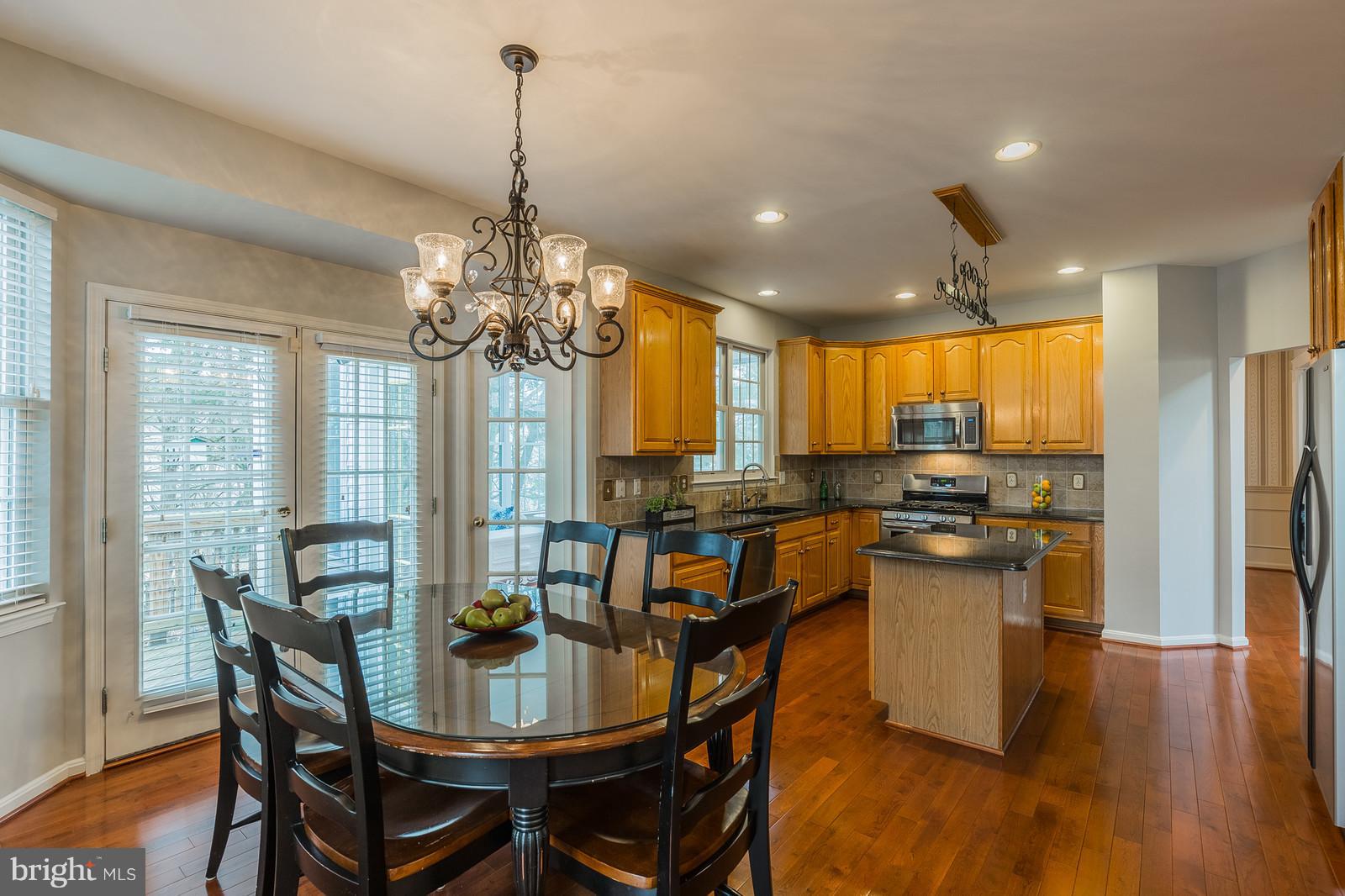 43553 Dempsey Lane Chantilly, VA 20152 - Photo 6 of 30 a view of a dining room with furniture window and wooden floor