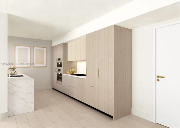 a kitchen with a refrigerator a stove top oven and cabinets
