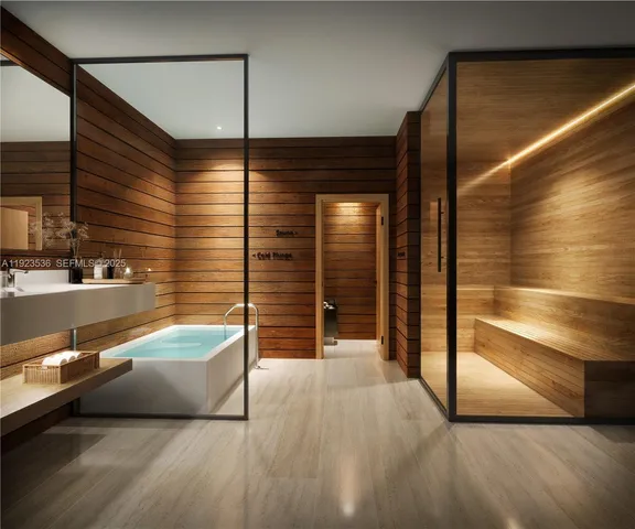 a bathroom with a bathtub and shower