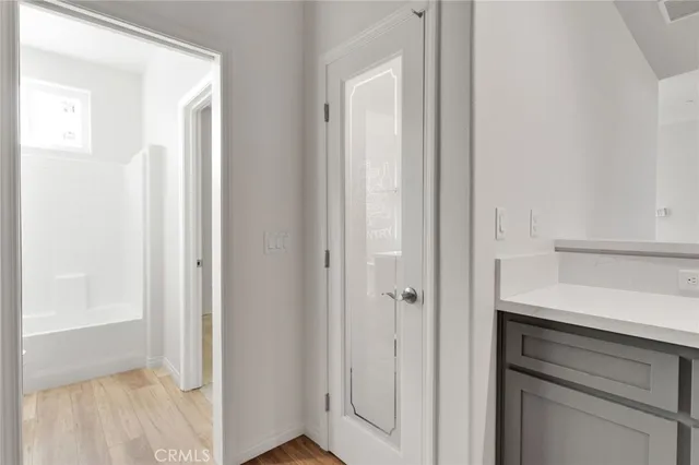 a room with a closet and mirror