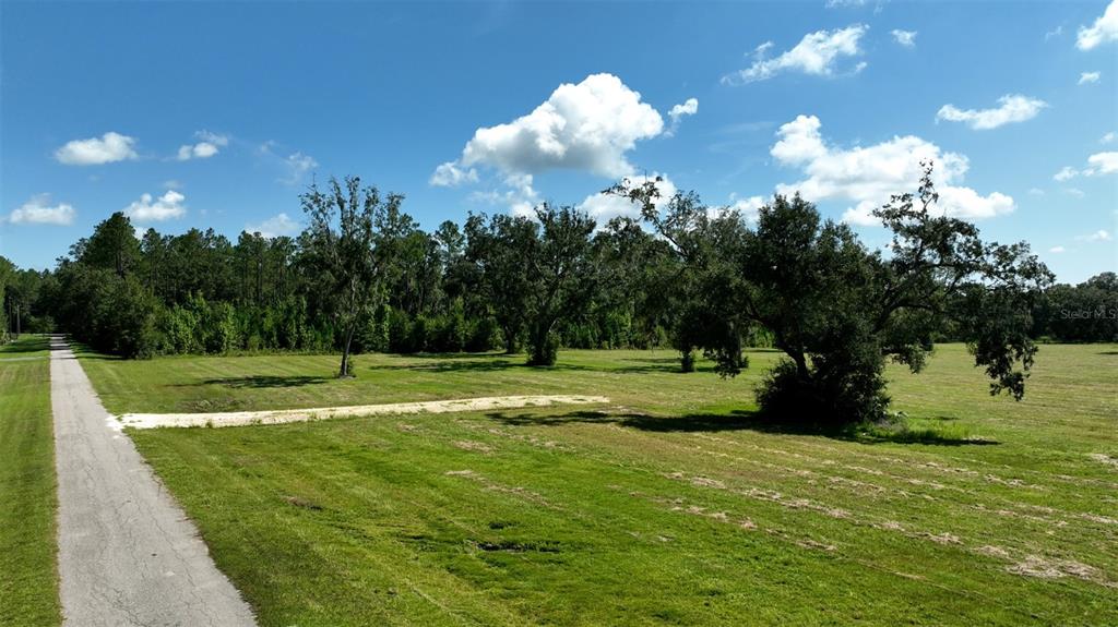 Northwest 116th Court Reddick, FL 32686 - Photo 11 of 18 a view of a golf course with a lake