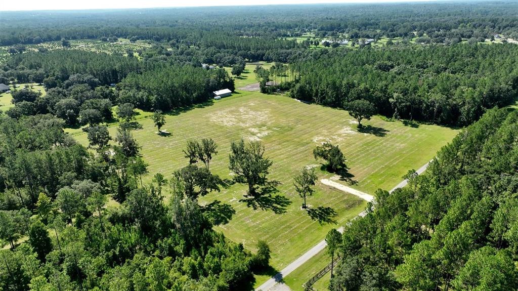 Northwest 116th Court Reddick, FL 32686 - Photo 2 of 18 an aerial view of lake residential houses with outdoor space and trees