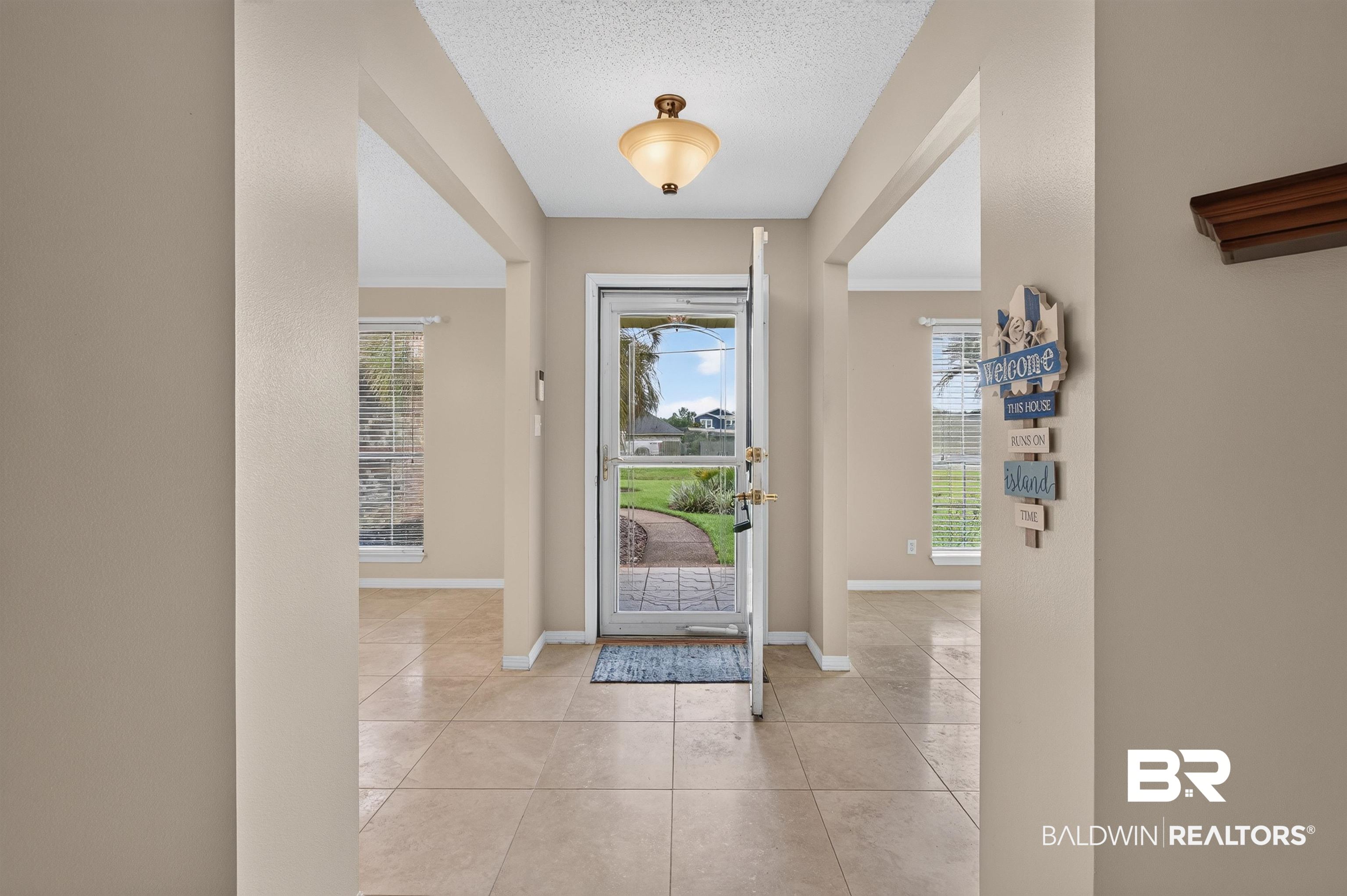 22685 County Road 12 Foley, AL 36535 - Photo 19 of 89 Entryway featuring light-toned tile flooring, neutral wall paint, and arched openings