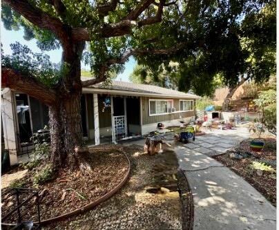 a front view of a house with sitting area