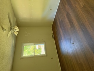 103 Gilkeson Road Honea Path, SC 29654 - Photo 4 of 25 This bright room features a window overlooking the lush outdoors, complemented by rich wood flooring.