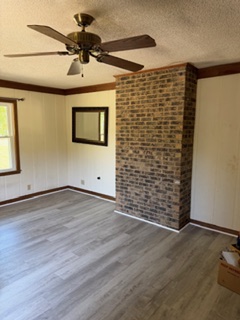 103 Gilkeson Road Honea Path, SC 29654 - Photo 7 of 25 This versatile space offers potential for various living arrangements, highlighted by a prominent brick accent.