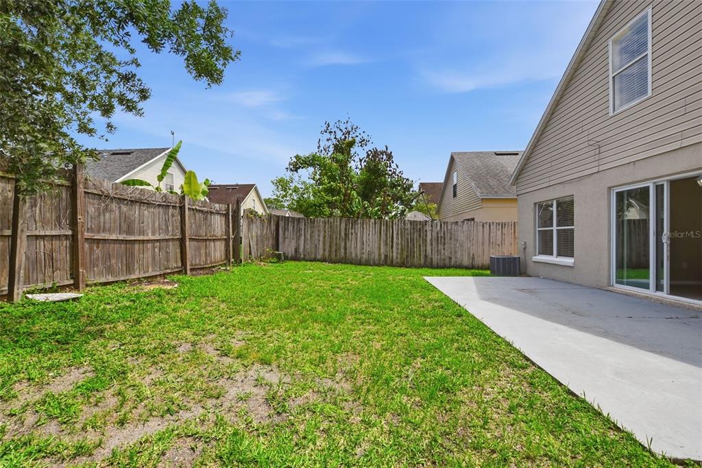 617 Greys Ferry Road Orlando, FL 32811 - Photo 32 of 35 a view of a backyard with a garden